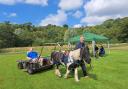 An individual supported by the National Autistic Society Scotland enjoying a ride in the pony trap