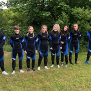 CJCE volunteers get paddle-boarding treat after helping at football camps