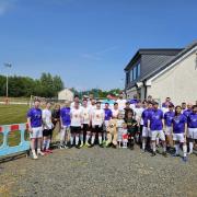 The two teams who took part in the fundraising football match for Ava Bolton, held at Loch Park in New Cumnock.