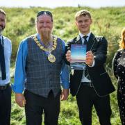 DH Mr Johnston with Provost Todd, Kyle from Stewarton Academy and Cllr Elaine Cowan with the Ayrshire Coastal Path guidebook