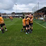 Talbot's players celebrate the first of their four goals on Saturday