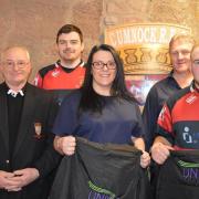 Unison representatives Wilma Gilroy and John Calder attended the game to present new substitute jackets bearing the Unison logo to Cumnock RFC president Bobby Horton.