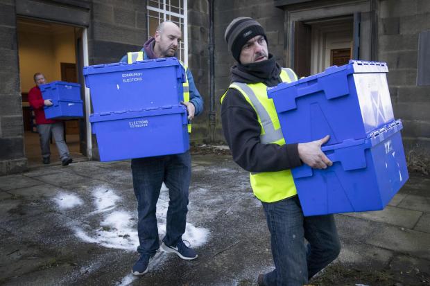 Ballot boxes and signs are dispatched to polling stations Photo: Jane Barlow/PA Wire.