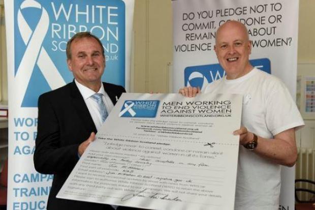 Cllr Jim McMahon with the White Ribbon pledge in 2019.