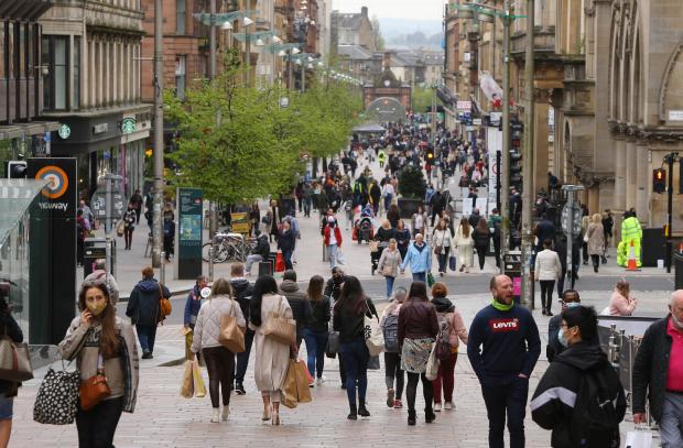 Cumnock Chronicle: Shoppers on Buchanan Street, Glasgow today, Monday 26th April. Shops, cafes, pubs, hospitality venues, gyms and museums opened today due to the easing of lockdown restrictions.  Photograph by Colin Mearns26 April 2021