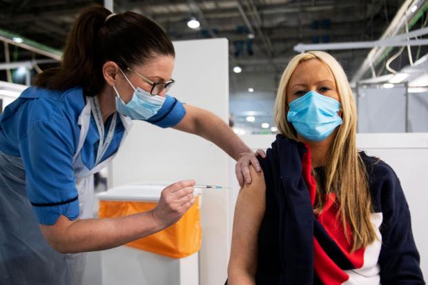 Cumnock Chronicle: A Covid vaccine being administered at the Hydro in Glasgow. There has been concern at the recent number of no-shows