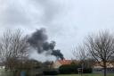 Thick black smoke billows across Kilwinning as crews tackle fire