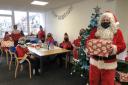 Allan Dorans donned a Santa suit to cheer up residents.