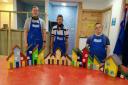UCAN trainees make and paint new houses to be placed at woodland fairy village