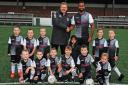 Steven Kelly with sponsor Adil Mukhtar and the new Cumnock kids team