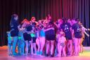 An 'LE Dance Fusion' group hug after the show