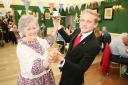 House steward Jamie Black from Monkton, dancing with Dumfries House Sewing Bee member (and Coronation guest) Reece Wilkie, 76, from Cumnock, as Coronation celebrations got under way at Dumfries House