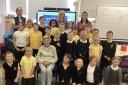 Primary 4 pupils with former teacher Mrs Jean McMurdo