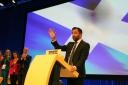 Humza Yousaf arrives on stage to deliver his speech to the SNP annual conference in October