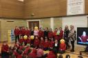New Cumnock Primary pupils are presented with their school's Communication Friendly School status.