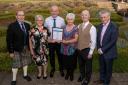 AWARD PRESENTATION: Beechgrove garden presenter George Anderson with group members Fay Rafferty,Gary Hughes (chairman), Liz Harkness and Richard Lamb with a Keep Scotland Beautiful official
