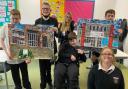 S3 pupils proudly presenting their artwork