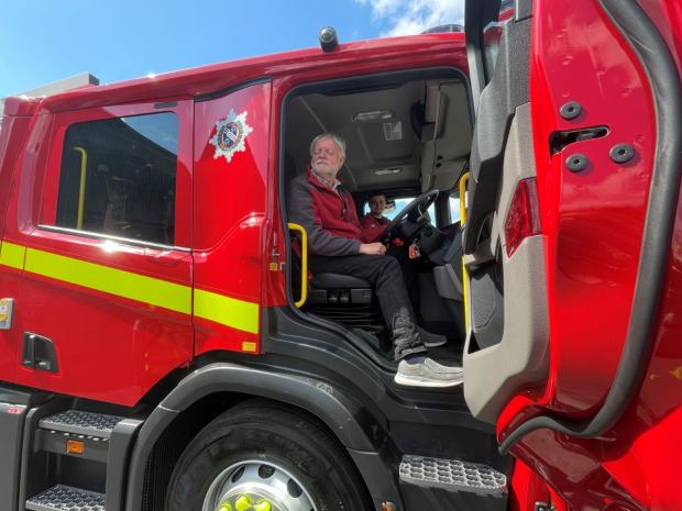 Cumnock Chronicle: Ian Hamilton fulfils a lifetime dream to sit in a fire engine