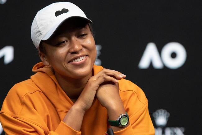 Naomi Osaka smiles during her press conference on Saturday