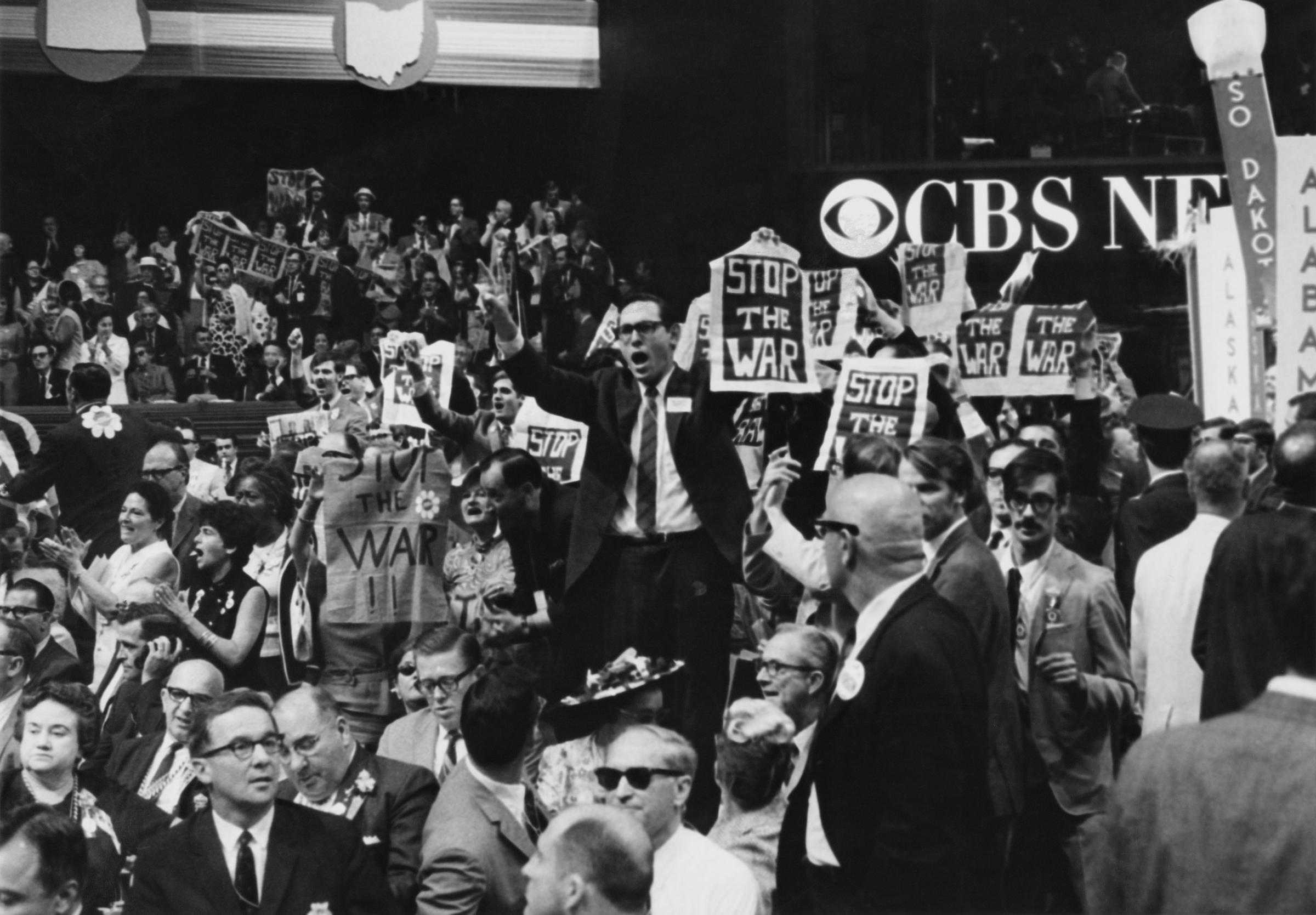 New York delegates holding stop the war banners in protest at the USAs continued involvement in the Vietnam War, on the third day of the 1968 Democratic National Convention, held at the International Amphitheatre in Chicago, Illinois, 28th August