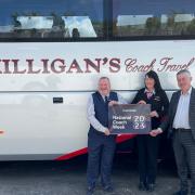 RHA’s Martin Bell, Milligan's Coach Travel's operations manager Morag Milligan and MP Alan Brown