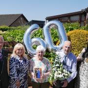 William and Catherine Peebles pictured at their Cumnock home with the three special visitors who helped celebrate the couple's diamond wedding anniversary