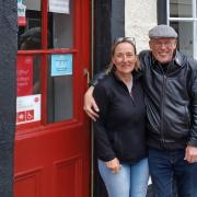 Mary and Barry Ford outside the world's oldest post office in Sanquhar