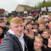 Blair gets to see how happy a day out at the football makes kids when he films his YouTube videos.