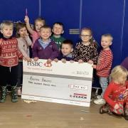 EGGER handed over a cheque for £300 to the Burns Bairns in Mauchline