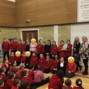 New Cumnock Primary pupils are presented with their school's Communication Friendly School status.