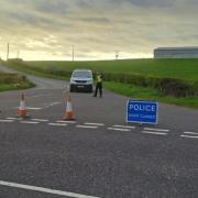 Police closed roads near the scene of the crash