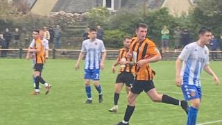 Goalscorer David McGrath (centre) in action