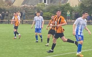 Goalscorer David McGrath (centre) in action